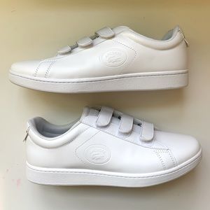 Lacoste strap on shoes. US 9.5. But can fit a US 10. Only worn once indoors.